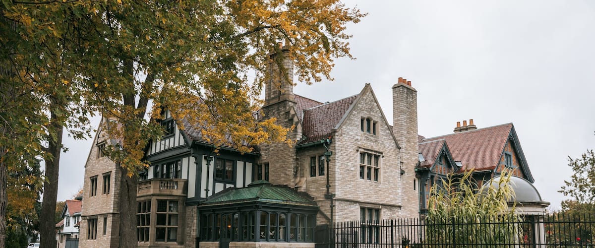 Willistead Manor featuring a house, heritage elements and autumn leaves
