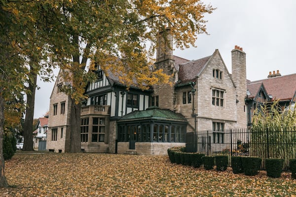 Willistead Manor featuring a house, heritage elements and autumn leaves