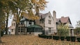 Willistead Manor featuring a house, heritage elements and autumn leaves