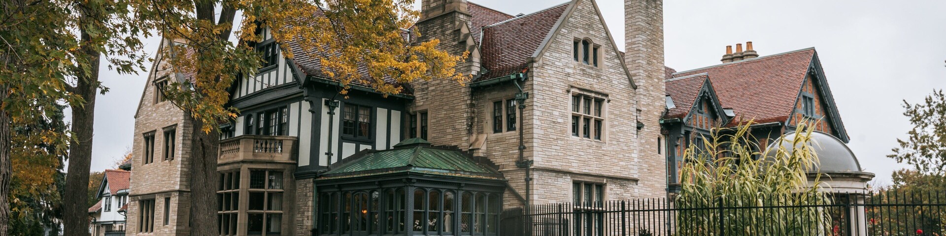 Willistead Manor featuring a house, heritage elements and autumn leaves