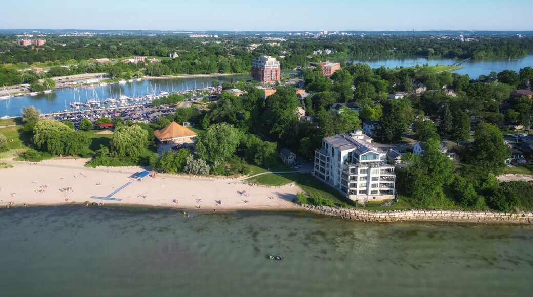 Aerial over Lakeside Park Beach in the Port Dalhousie area of St. Catharines, Ontario, Canada, on the south shore of Lake Ontario, with Martindale Pond. Shot on a summer afternoon in July, 2024.