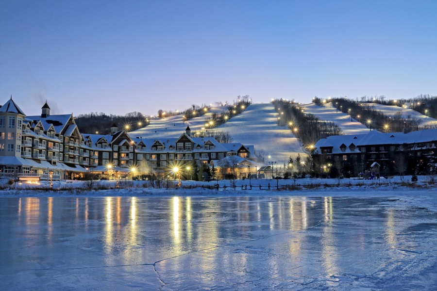 Blue Mountain Village with ski slopes, lodges and spas in the evening