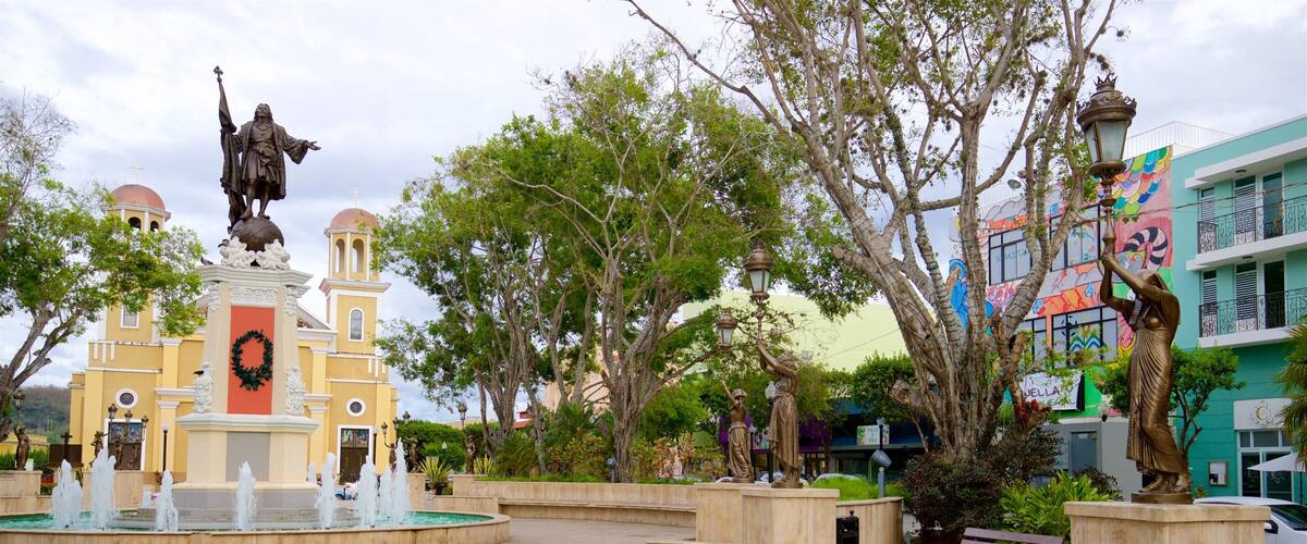 Christopher Columbus Statue featuring a statue or sculpture, a park and a fountain