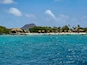 Renaissance Island private beach for guests of Renaissance Wind Creek Aruba Resort. Hooiberg (Haystack) mountain in the distance.