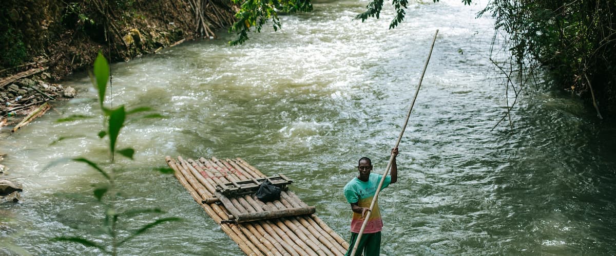 Martha Brae River showing a river or creek and kayaking or canoeing as well as an individual male