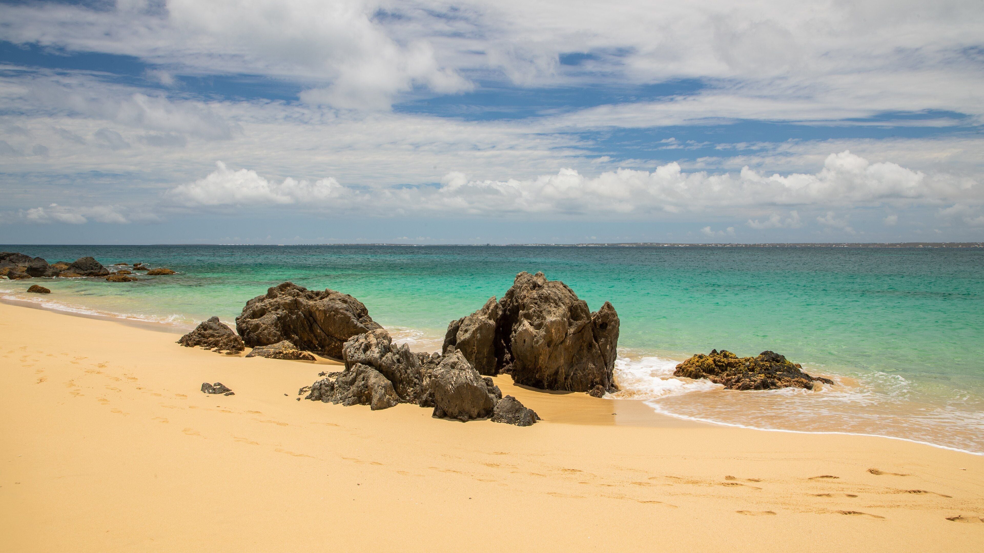 Happy Bay Beach which includes general coastal views and a sandy beach