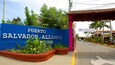 A sign for Puerto Salvador Allende with a blue background and white lettering.
