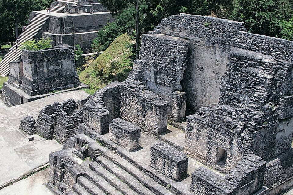Ancient ruins with stone structures and steps.