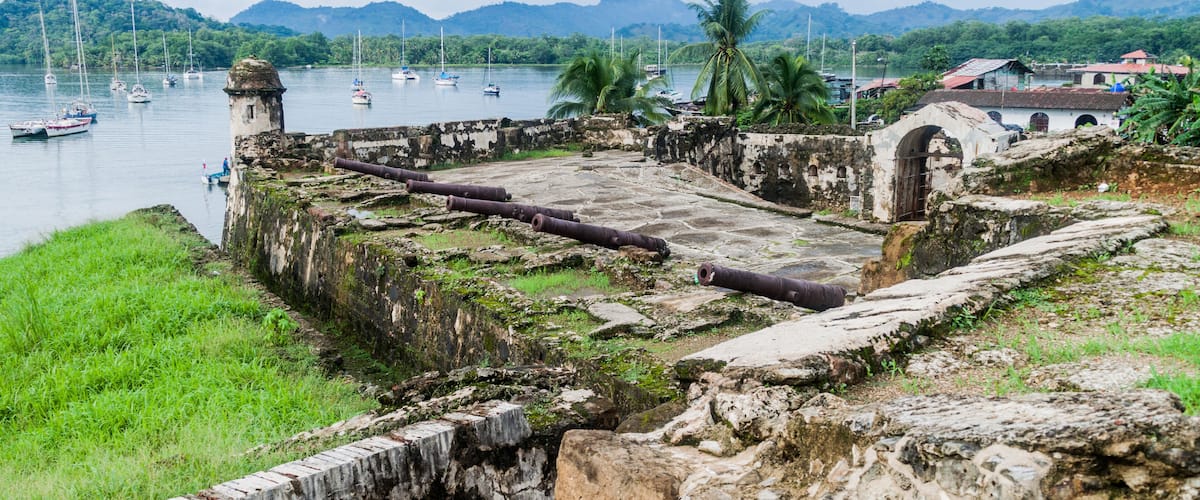 Sail boats and Fuerte Santiago fortress in Portobelo village, Panama