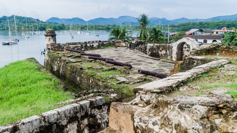 Sail boats and Fuerte Santiago fortress in Portobelo village, Panama