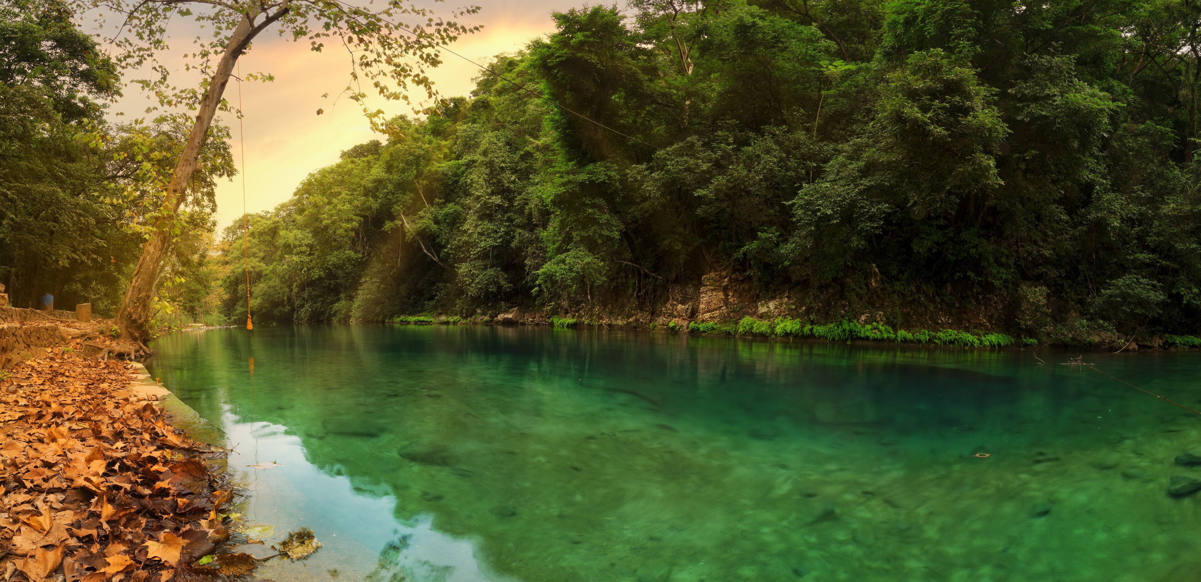 sunset in the river with reflex,Forest river stones landscape,beautiful panoramic view of the river in Bridge of God and Waterfalls of Tamasopo san luis potosi mexico