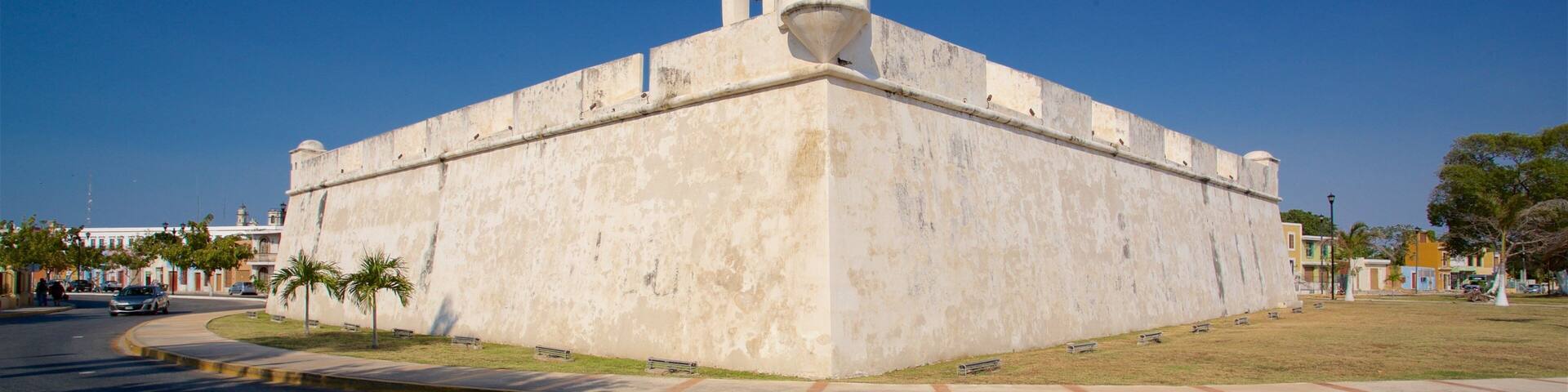 A large, historic fort with a prominent tower and a well-maintained surrounding area.