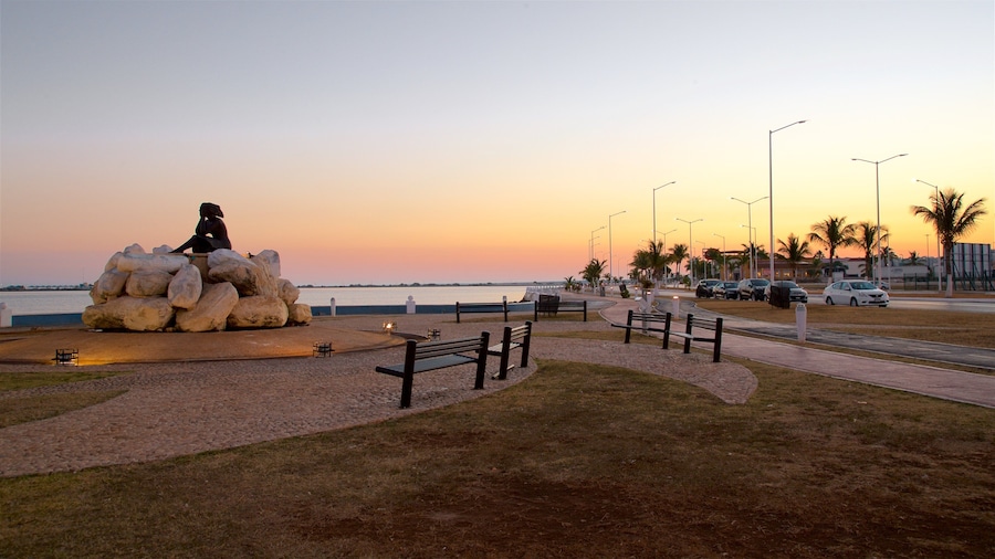 Novia del Mar Monument showing a garden, outdoor art and a sunset