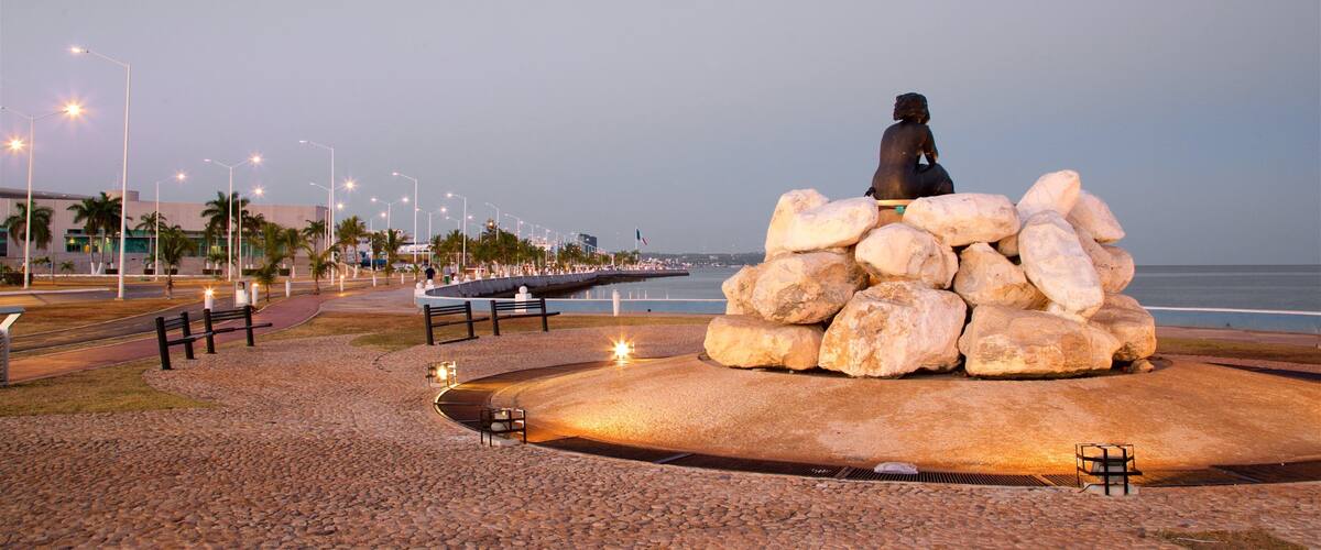 Novia del Mar Monument featuring outdoor art, general coastal views and a sunset