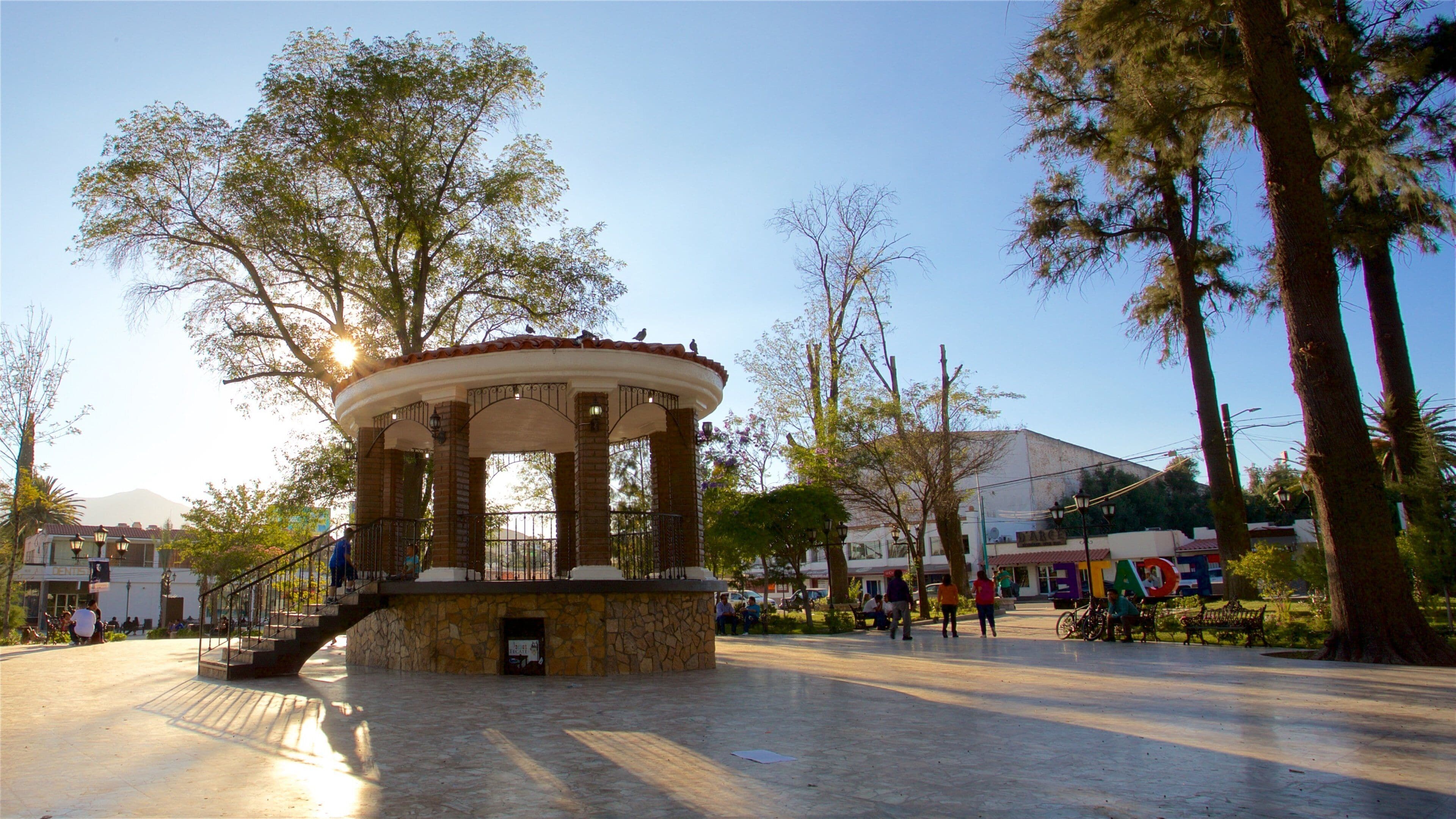 Tecate which includes a sunset, heritage elements and a square or plaza