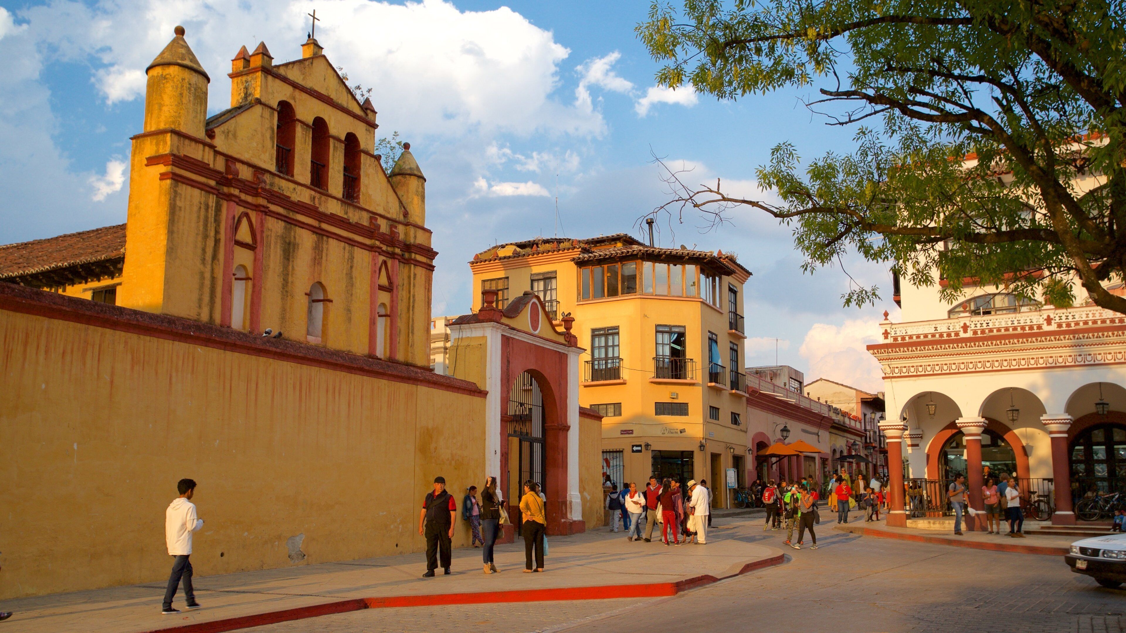 Plaza 31 de Marzo which includes a church or cathedral and heritage elements as well as a small group of people