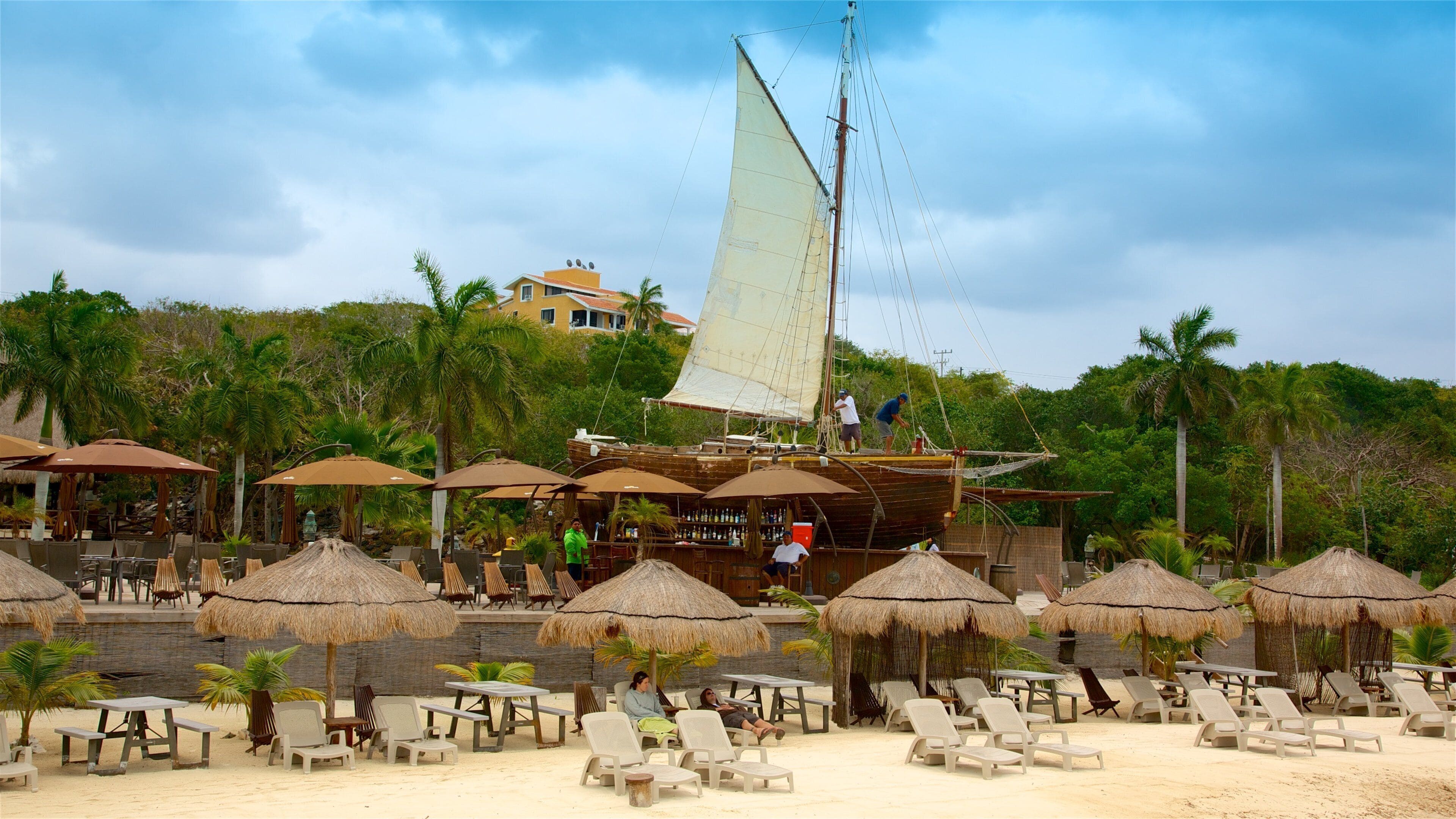 Capitán Dulché Museum featuring tropical scenes, a sandy beach and general coastal views