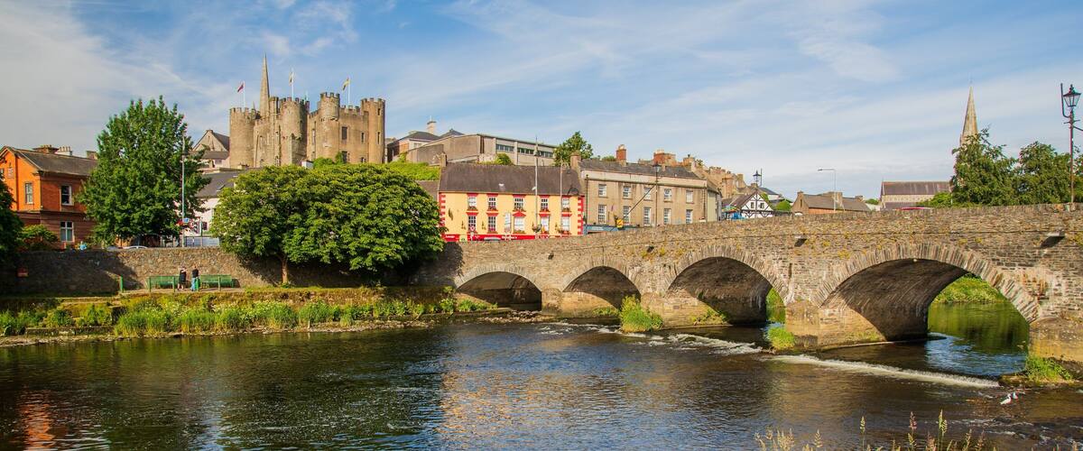 Enniscorthy Castle showing a bridge, heritage architecture and a river or creek