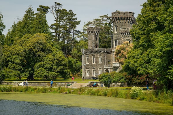 Johnstown Castle & Gardens which includes a lake or waterhole, heritage architecture and a castle