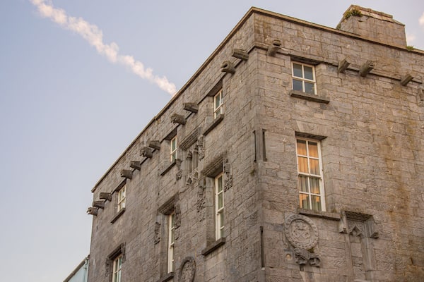 Lynch\'s Castle showing heritage architecture and a sunset