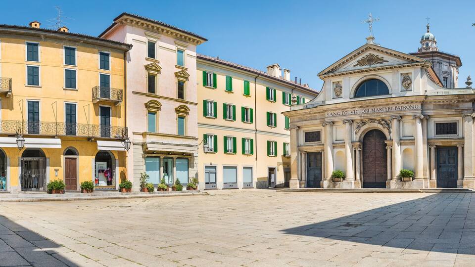Historic center and pedestrian area in Varese, an important city in northern Italy. Basilica of San Vittore, among eighteenth-century, nineteenth-century and twentieth-century palaces