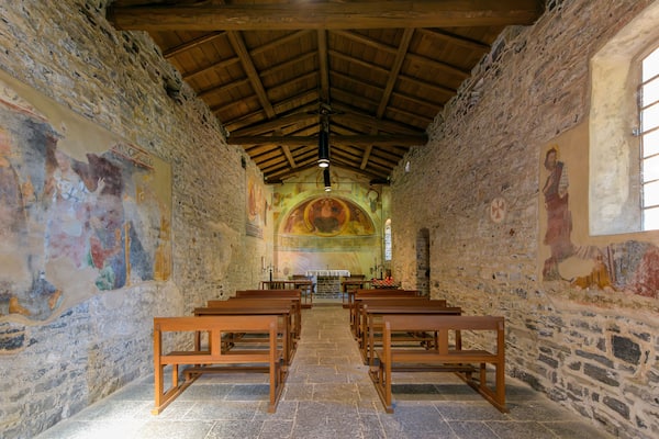 Interior of the 11th century Church of St. John the Baptist, or San Giovanni Battista, one of the oldest churches on Lake Como, in the village of Varenna, Italy.