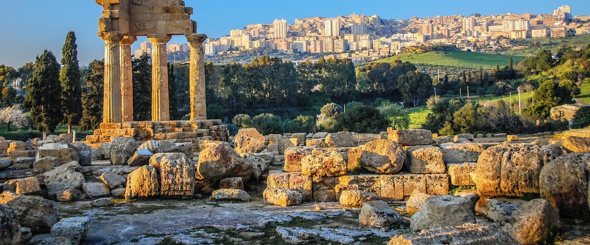 Ruins of Temple of Castor and Pollux with Agrigento, Sicily in the background