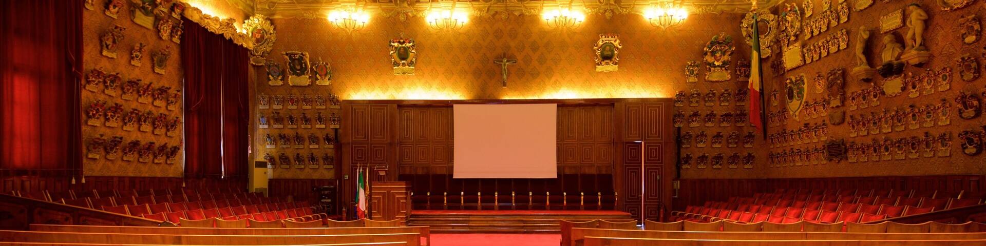 Palazzo del Bò featuring a church or cathedral, heritage elements and interior views