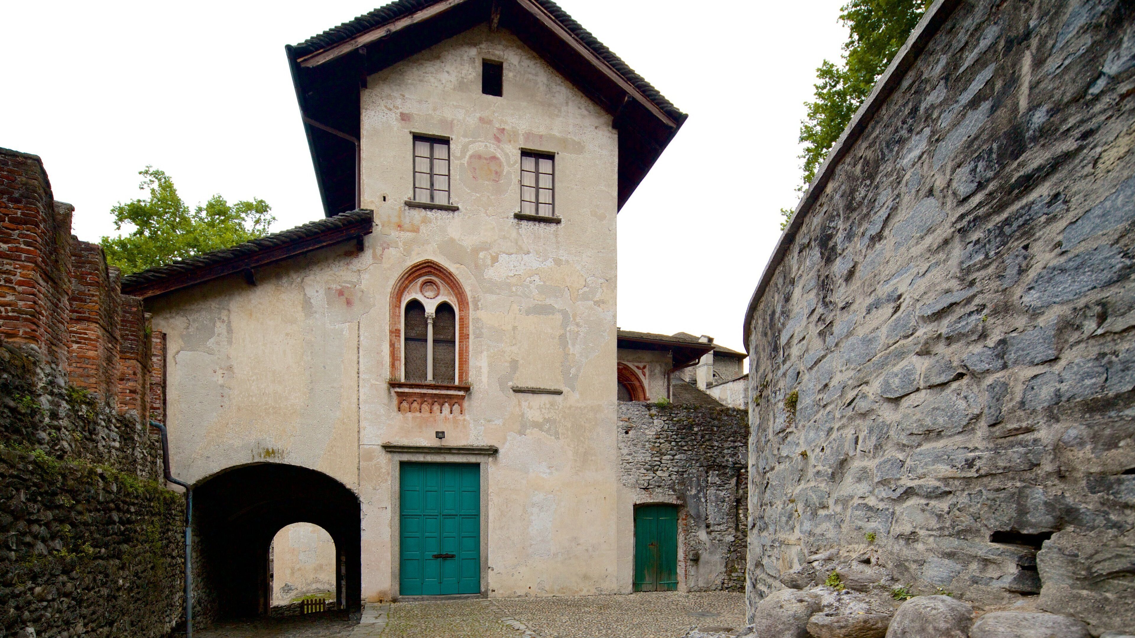 Castello Visconteo which includes heritage elements and a house