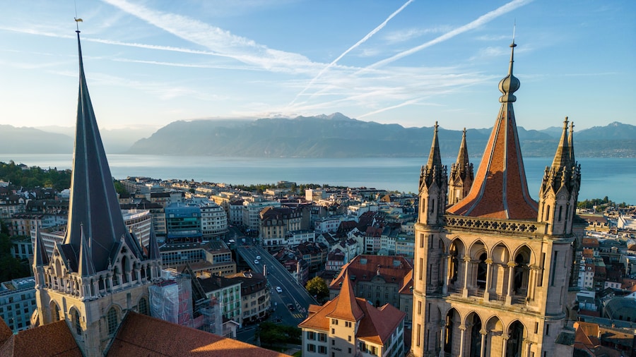 August 22nd 2022, Lausanne, Switzerland. A drone aerial shot of Lausanne cathedral and Lake Geneva at sunrise.