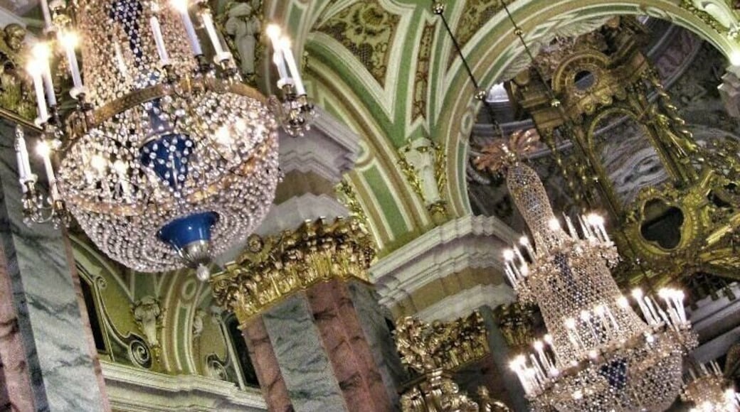 The interior of the cathedral is comfy and brightly colored. It is built in Baroque style.
Source: http://www.saint-petersburg.com/cathedrals/Peter-Paul-Cathedral.asp
The inside of the cathedral holds a fantastic iconostasis, completed by a group of more than forty Moscow architects under Ivan Zarudny from 1722-1727. Whereas the architectural style of the cathedral is similar in style to the Lutheran church, the painting of the iconostasis is more in the spirit of Catholic Church icons. The walls of the cathedral are also embellished with paintings of various bible themes, including many paintings of gospel stories by artists of the early and mid 18th century.