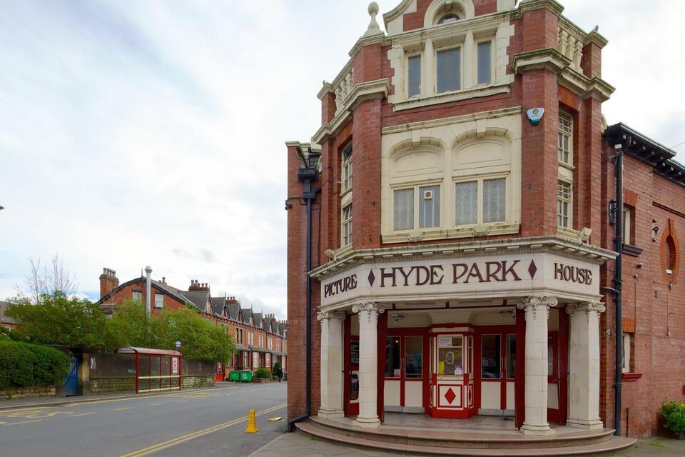 A red brick building with a sign reading "Hyde Park Picture House."