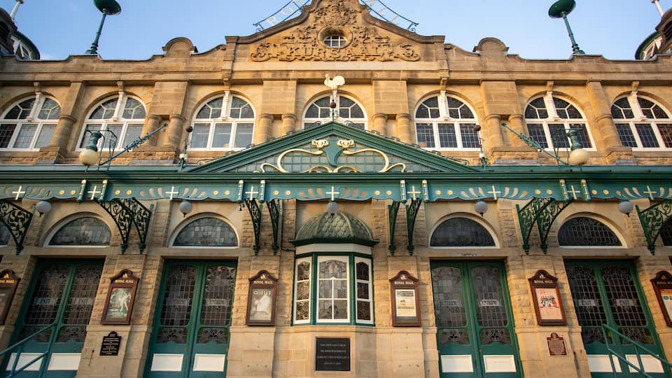 A historic building with ornate architecture, including a central dome and multiple arched windows.