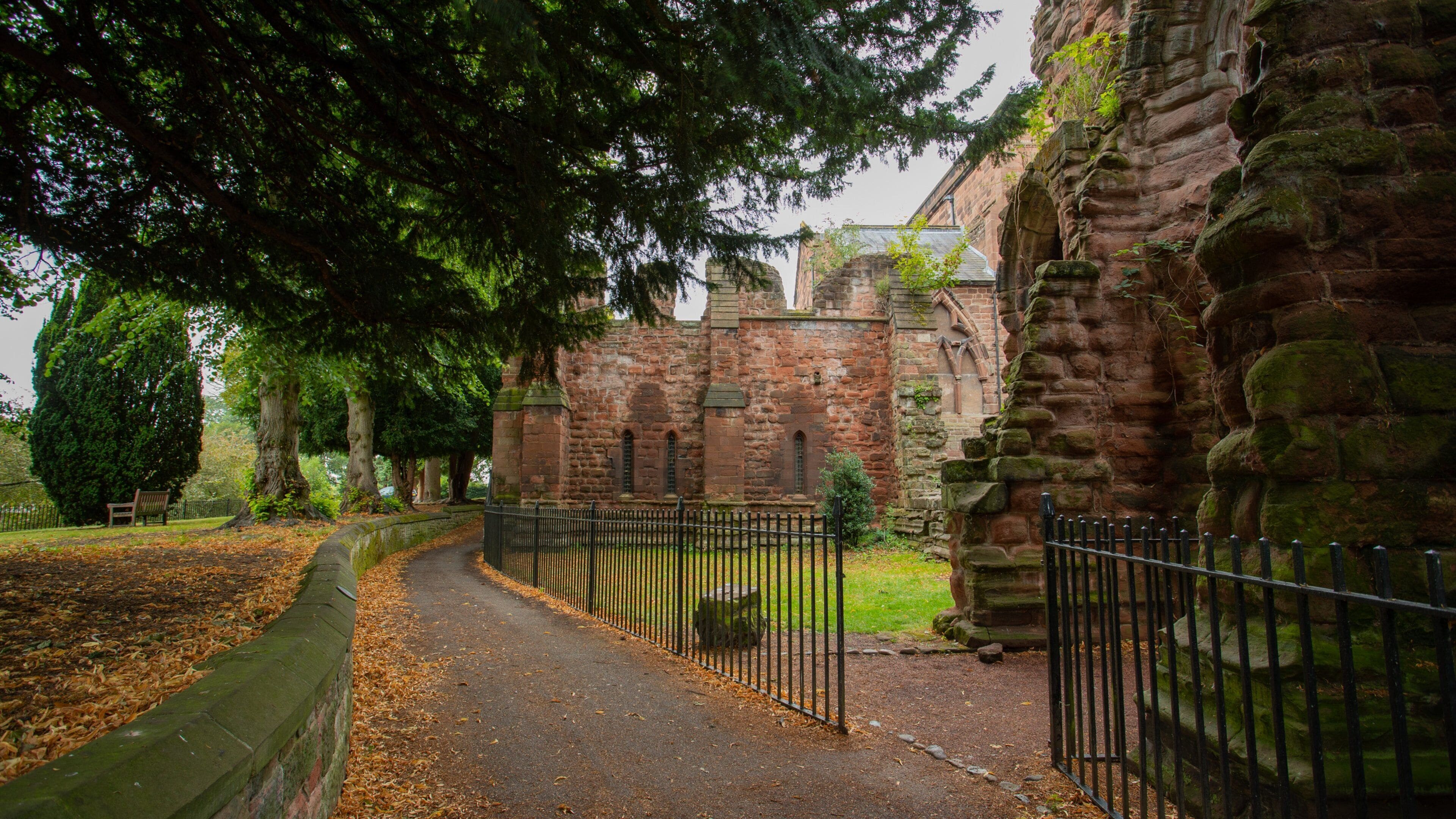 St John the Baptist Church showing a park, heritage elements and fall colors