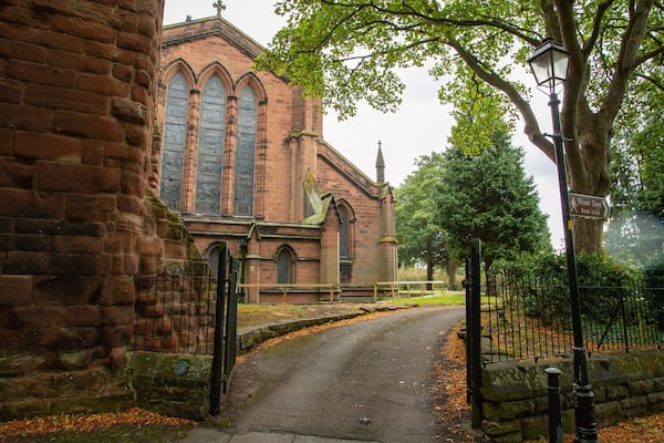 St John the Baptist Church which includes a church or cathedral, autumn leaves and heritage elements