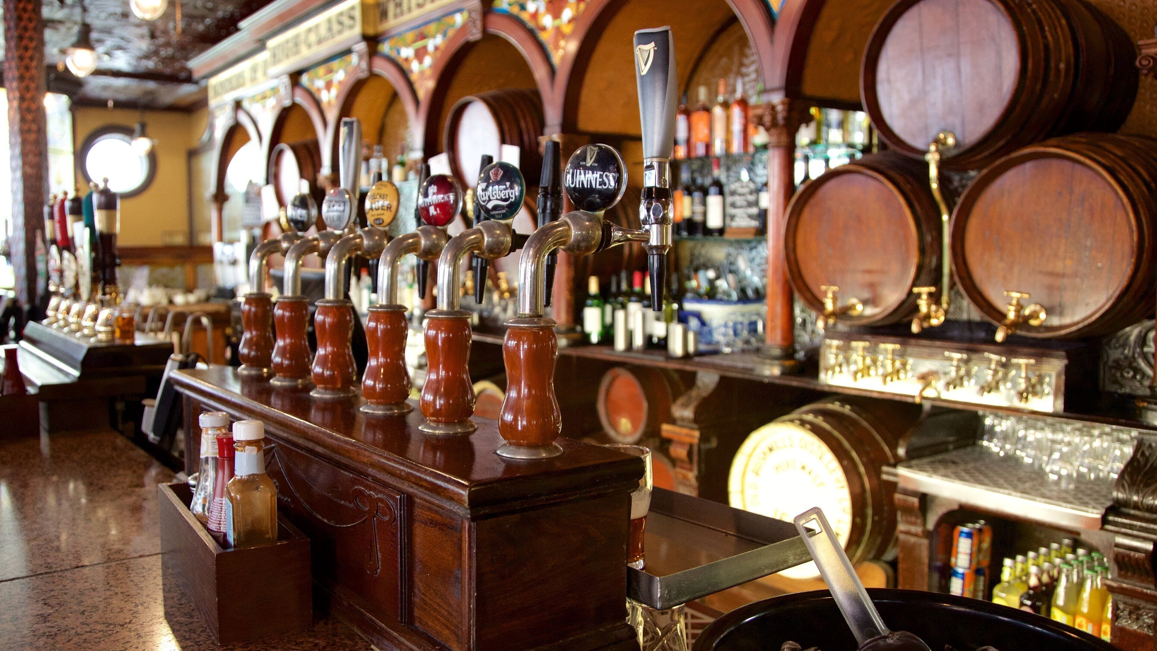 Crown Liquor Saloon which includes a bar, drinks or beverages and interior views