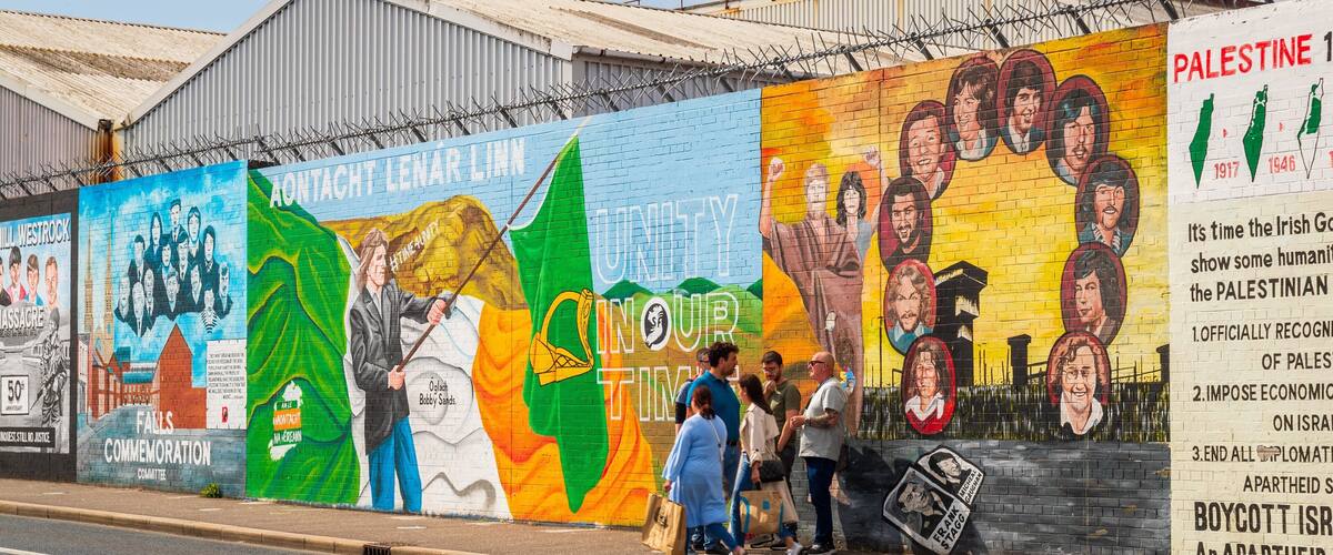 Peace Line featuring street scenes and outdoor art as well as a small group of people