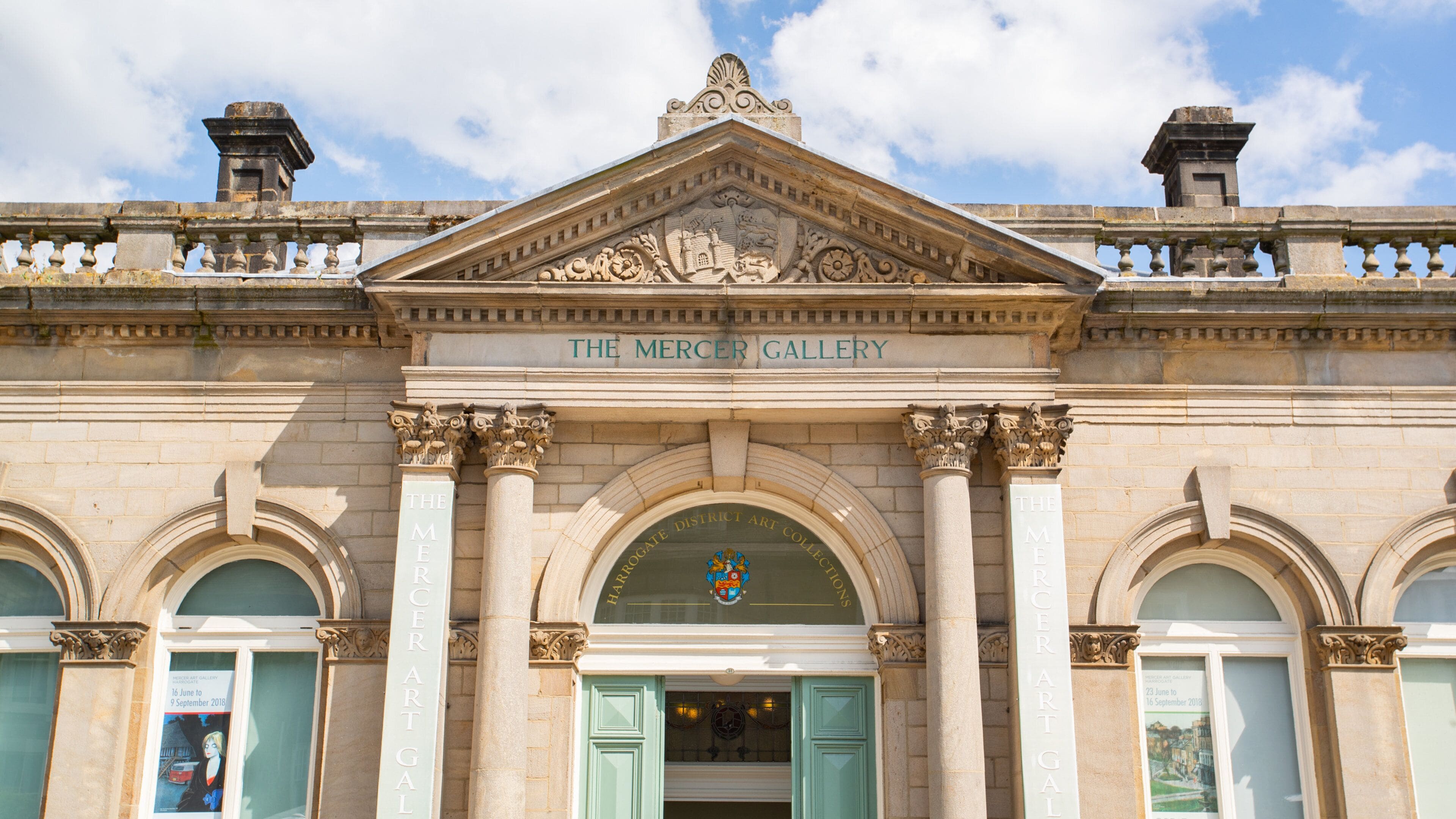 The Mercer's Gallery with classical architecture, including columns and an ornate pediment.
