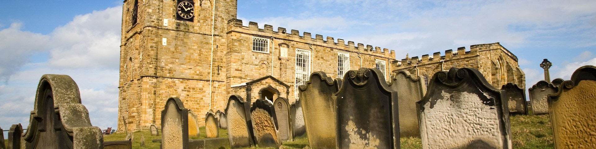 St Mary's church and graveyard against a blue sky in Whitby North Yorkshire England UK.; Shutterstock ID 132371075