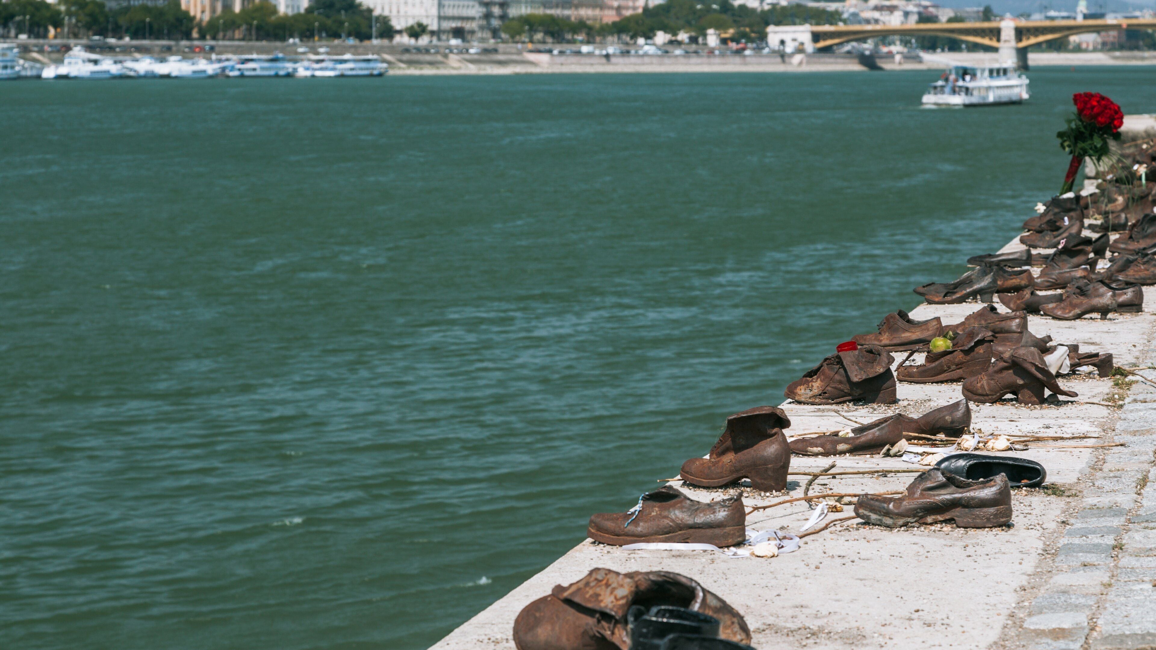 Shoes on the Danube showing a river or creek