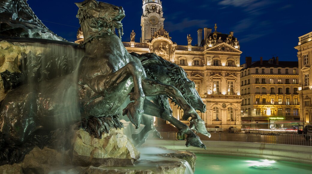 Renovated Fontain Bartholdi and Hotel de Ville de Lyon at Place des Terreaux in the evening.