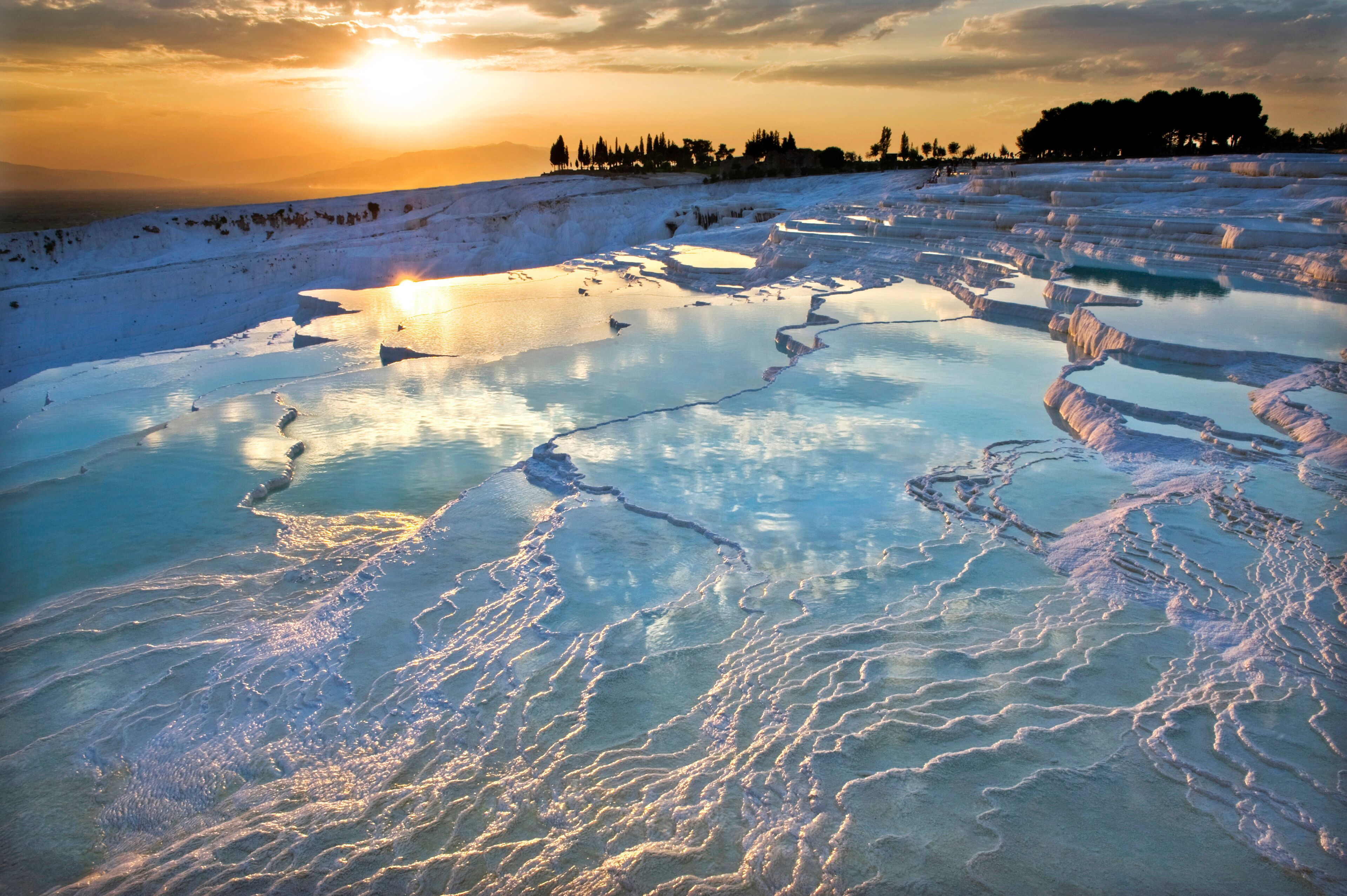 Carbonate travertines the natural pools during sunset, Pamukkale, Turkey - UNESCO HERITAGE