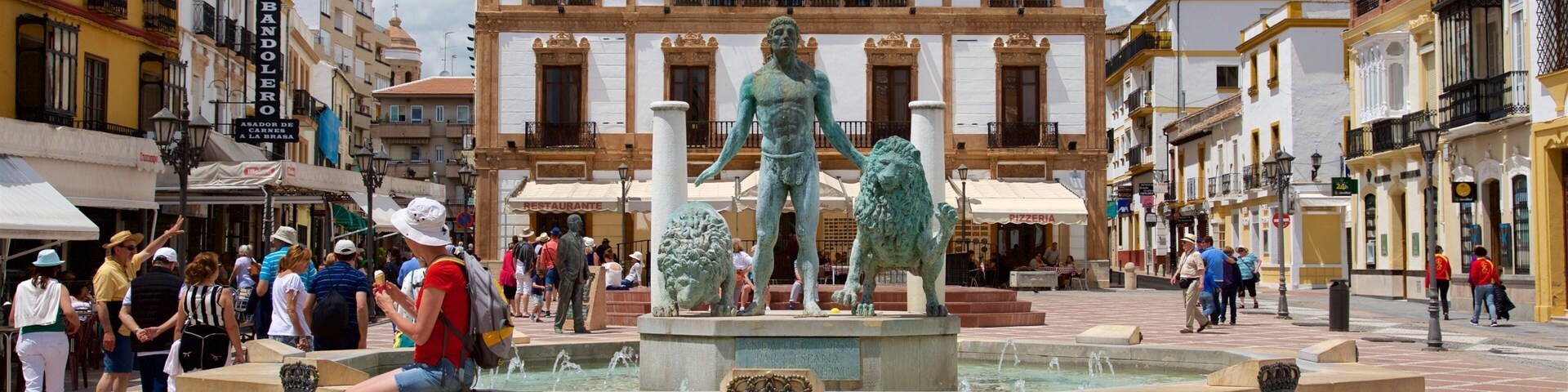 Ronda featuring a square or plaza, a fountain and a statue or sculpture