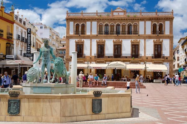 Ronda which includes a square or plaza, a statue or sculpture and a fountain