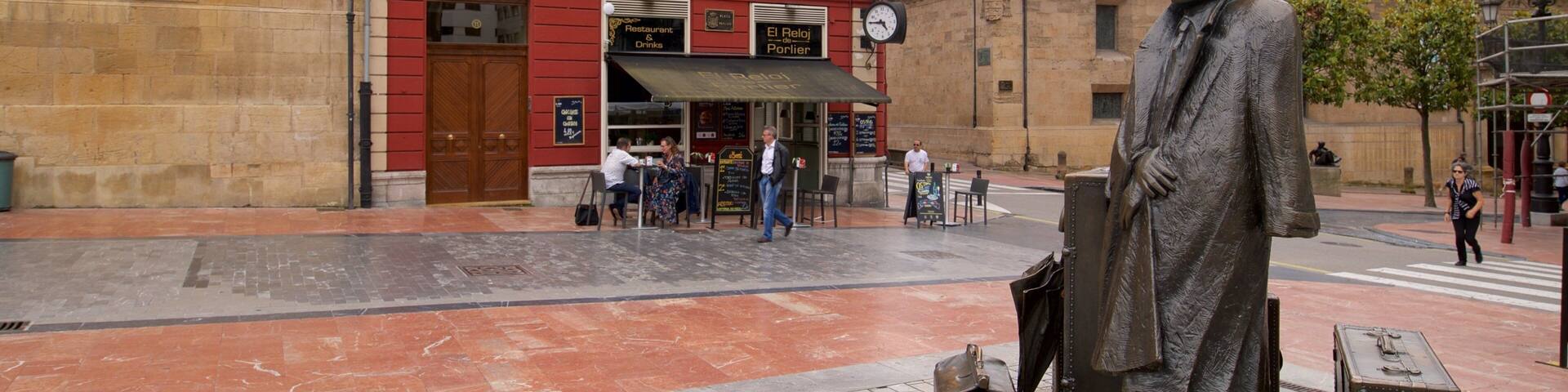 Plaza de Porlier featuring a statue or sculpture and heritage elements