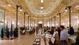 A spacious indoor venue with high wooden ceilings and natural light.
