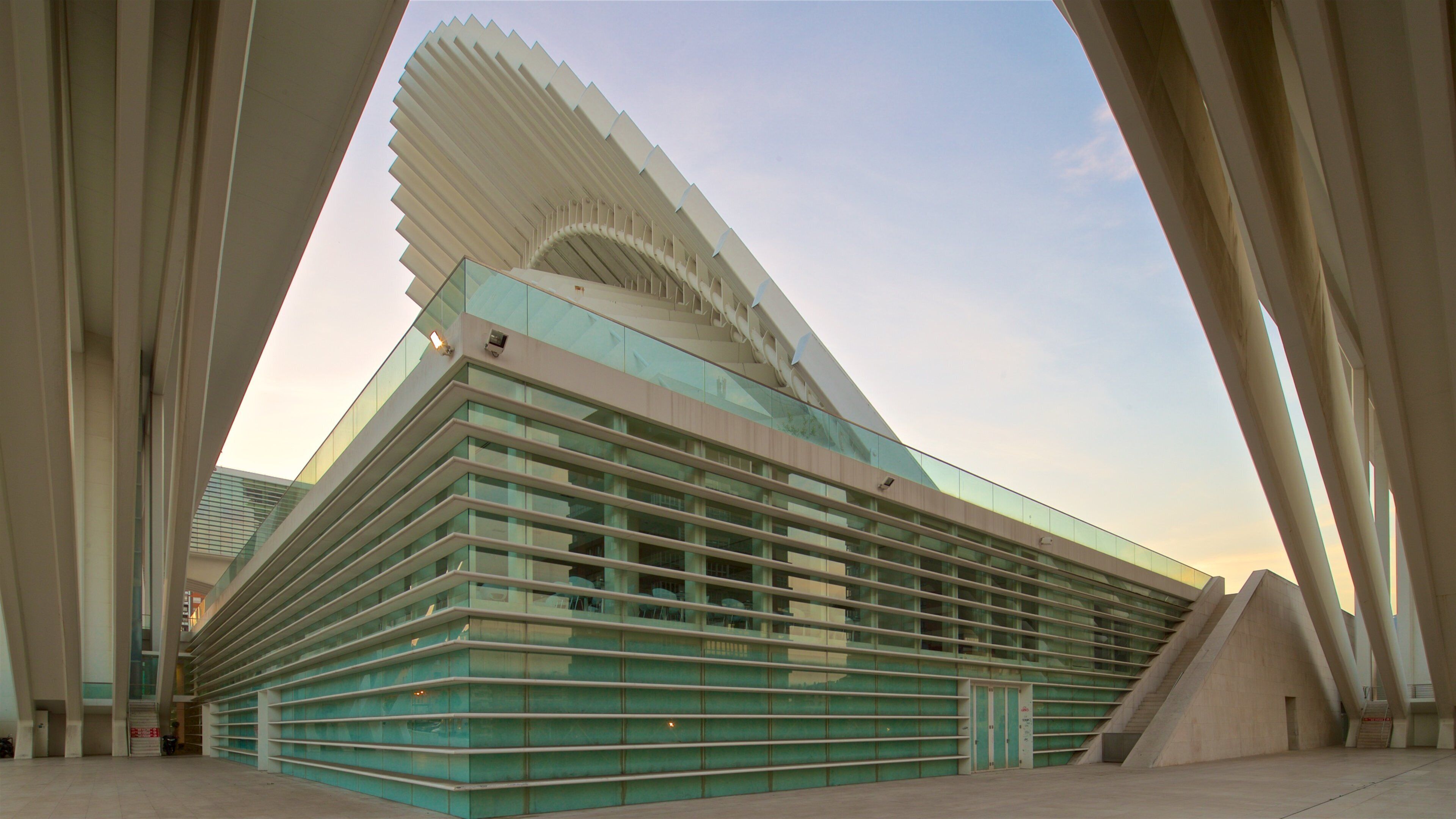 Palacio de Exposiciones y Congresos featuring a city, a sunset and modern architecture