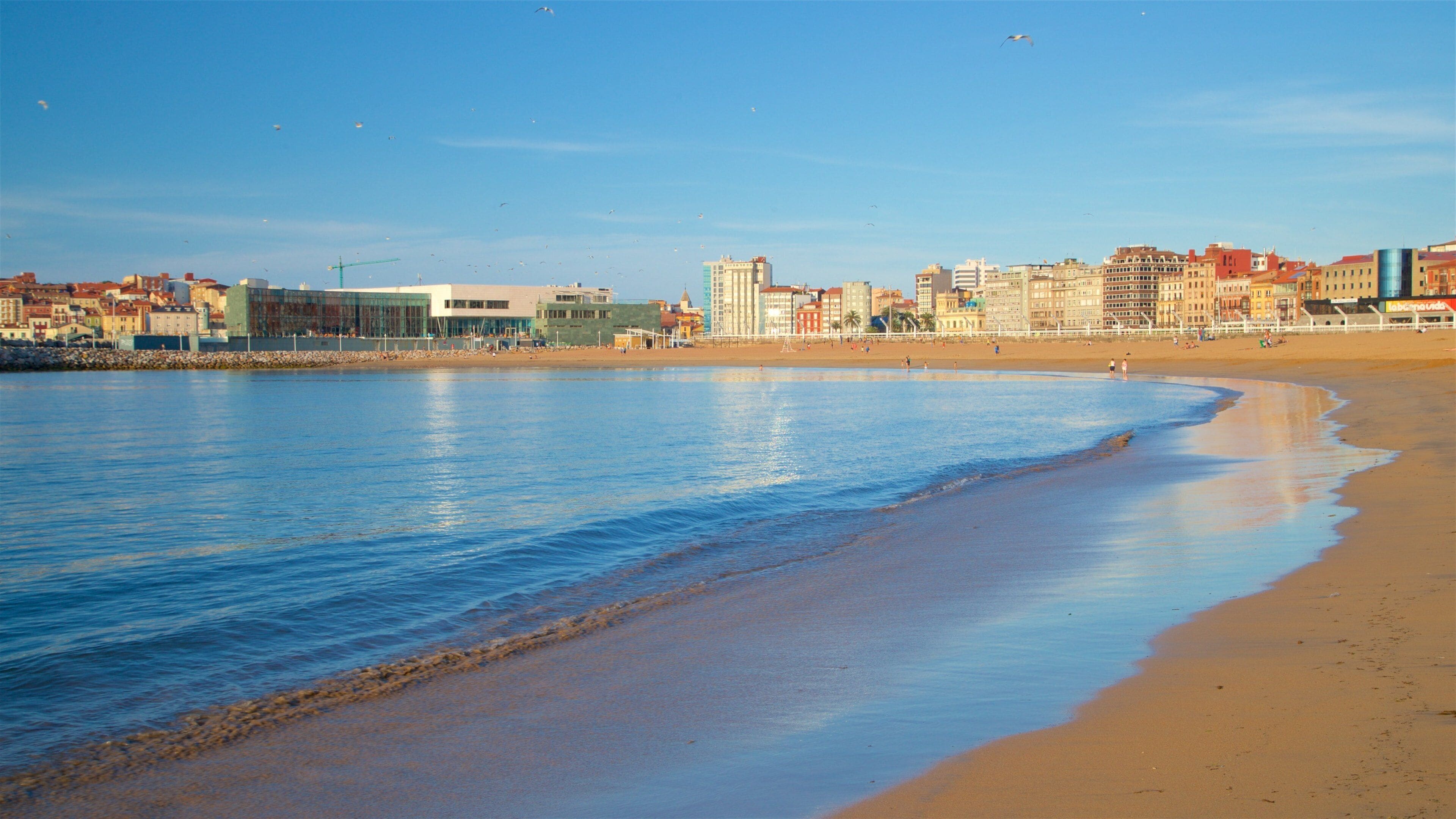 Playa de Poniente which includes general coastal views, a coastal town and a beach