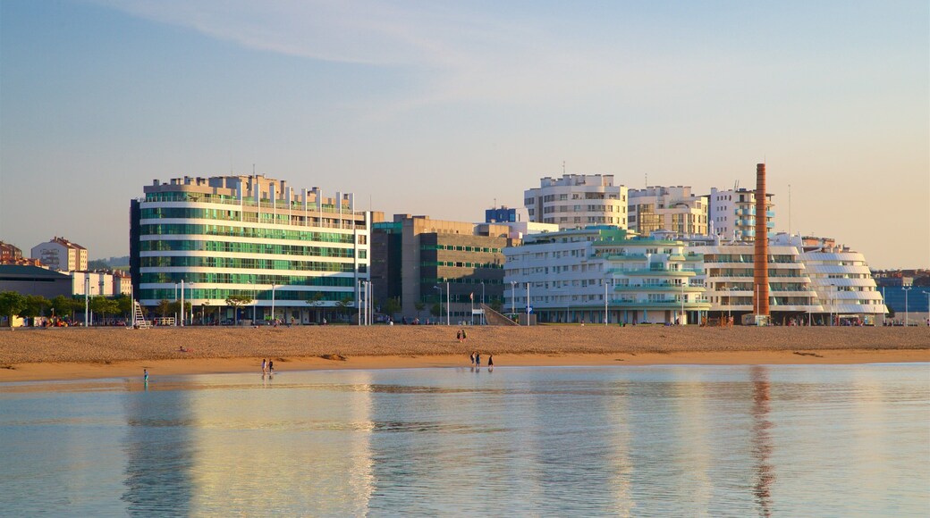 Playa de Poniente showing a sunset, general coastal views and a city
