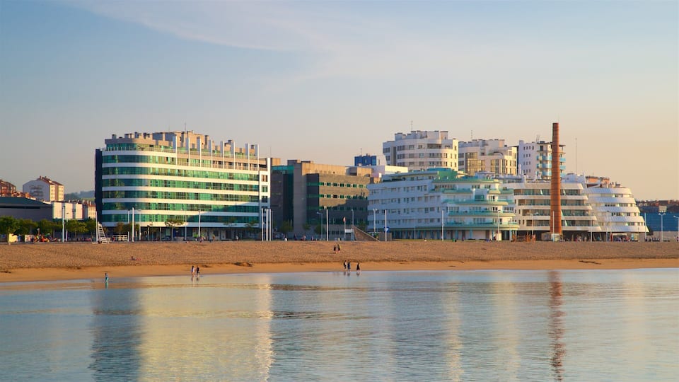 Playa de Poniente showing a sunset, general coastal views and a city